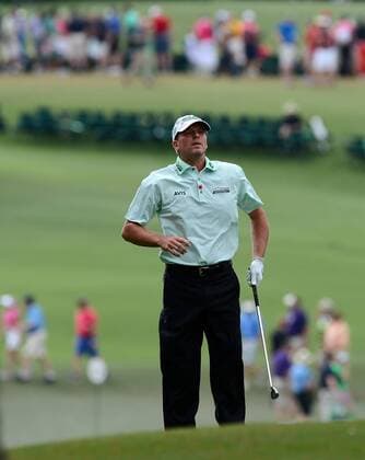 April 12, 2015 - Augusta, GA, USA - Steve Stricker leaps into the air to check the location of the second green prior to hitting his second shot during the final round of the Masters on Sunday, April 12, 2015, at Augusta National Golf Club in Augusta, Ga. Masters final round - ZUMAm67_