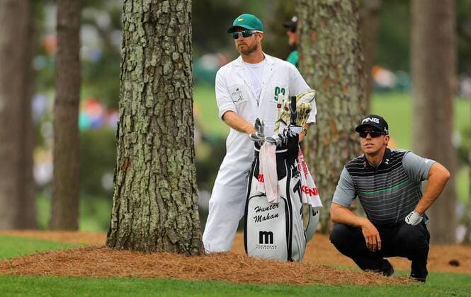 April 12, 2015 - Augusta, GA, USA - Hunter Mahan and his caddie, John Wood, line up his second shot from the woods off the first fairway during the final round of the Masters on Sunday, April 12, 2015, at Augusta National Golf Club in Augusta, Ga. Masters final round - ZUMAm67_