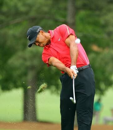 April 12, 2015 - Augusta, GA, USA - Tiger Woods hits his shot on the first fairway during the final round of the Masters on Sunday, April 12, 2015, at Augusta National Golf Club in Augusta, Ga. Masters final round - ZUMAm67_