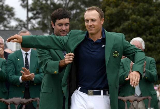 April 12, 2015 - Augusta, GA, USA - Bubba Watson, left, helps Jordan Spieth, right, into his green jacket after Spieth won the Masters on Sunday, April 12, 2015, at Augusta National Golf Club in Augusta, Ga. Masters final round - ZUMAm67_