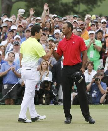 Woods, McIlroy in Masters Golf Tournament Rory McIlory (L) and Tiger Woods shake hands after finishing the final round of the 2015 Masters Golf Tournament at Augusta National Golf Club in Augusta, the United States on April 12, 2015. 