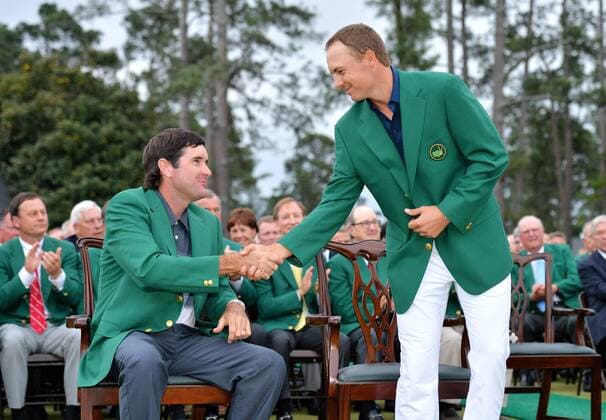 2014 Masters champion Bubba Watson shakes hands with on Jordan Spieth who are both wearing their Green jackets after Spieth wins the 2015 Masters Tournament at Augusta National Golf Club in Augusta, Georgia on April 12, 2015. Jordan Spieth wins his first major championship with a score of 18 under par.  AUG20150412166 KEVINxDIETSCH