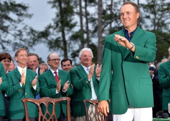 Jordan Spieth stands wearing his Green Jacket at the trophy ceremony after Spieth wins the 2015 Masters Tournament at Augusta National Golf Club in Augusta, Georgia on April 12, 2015. Jordan Spieth wins his first major championship with a score of 18 under par.  AUG20150412167 KEVINxDIETSCH