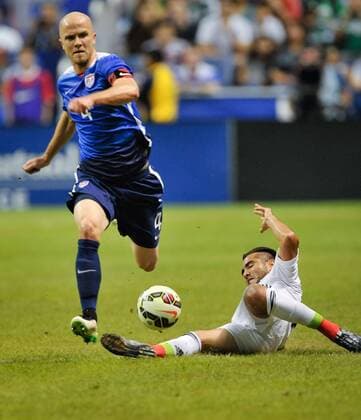 April 15, 2015 - San Antonio, TX, U.S - USA captain Michael Bradley dribbles past Mexico s Mario Osuna during a friendly match Wednesday April 15, 2015 at the Alamodome in San Antonio, Texas. The US Men s national team Nationalteam defeated Mexico, 2-0. News - April 15, 2015 - ZUMAbm2_