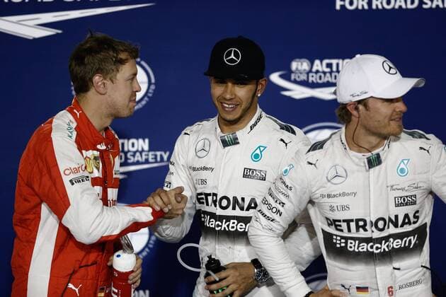 April 18, 2015 - Sakhir, Bahrain - Sebastian Vettel shaking hand with Lewis Hamilton after the qualifying session , in Bahrain, on April 18, 2015. F1 Grand Prix of Bahrain - Qualifying  - ZUMAn230