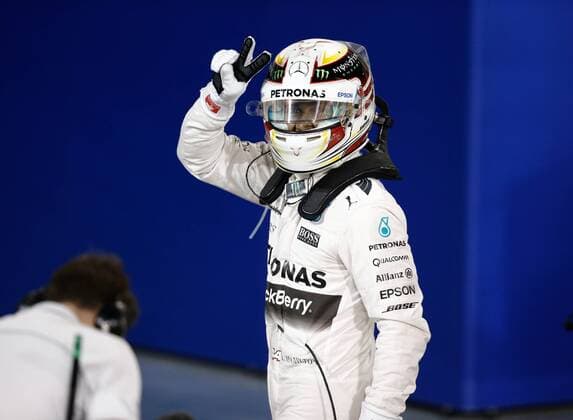 April 18, 2015 - Sakhir, Bahrain - Lewis Hamilton showing victory sign after the qualifying session, in Bahrain, on April 18, 2015. F1 Grand Prix of Bahrain - Qualifying  - ZUMAn230