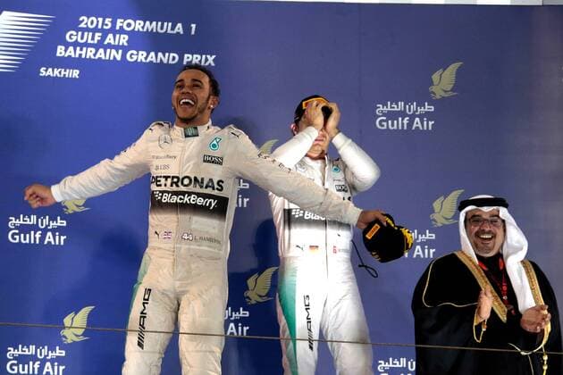 FORMULA 1 - Bahrain GP SAKHIR,BAHRAIN,19.APR.15 - MOTORSPORTS, FORMULA 1 - Grand Prix of Bahrain, Bahrain International Circuit, award ceremony. Image shows the rejoicing of Lewis Hamilton (GBR Mercedes GP) and Nico Rosberg (GER Mercedes GP). GEPAxpictures xFritzxMueller 