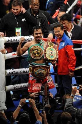 Manny Pacquiao (PHI), NOVEMBER 14, 2009 - Boxing : Manny Pacquiao of Philippines celebrates his champion belts after his 12th round TKO victory over Miguel Cotto of Puerto Rico in their WBO welterweight title bout at the MGM Grand Garden Arena in Las Vegas, Nevada, USA. NoxThirdxPartyxSales  (XQOA000301)
