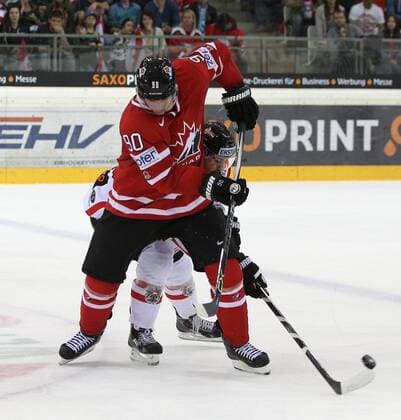 Ice hockey Eishockey - AUT vs CAN, test match VIENNA,AUSTRIA,29.APR.15 - ICE HOCKEY - OEEHV, international match Länderspiel Austria vs Canada, test match. Image shows Jason Spezza (CAN) and Martin Schumnig (AUT). GEPAxpictures xChristianxOrt 