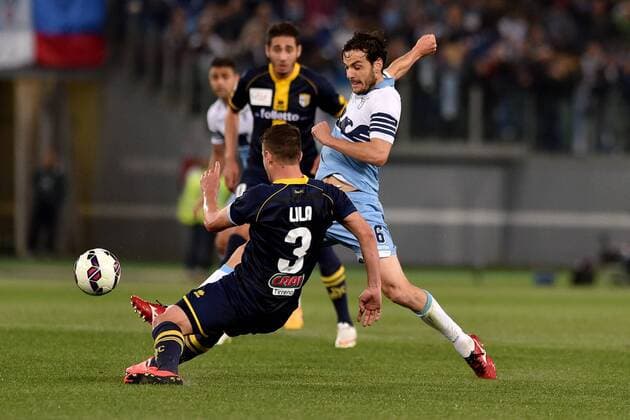 29.04.2015. Rome, Italy. Serie A Football. Lazio versus Parma. Andi Lila (Par) challenges Marco Parolo (Laz) xGiuseppexMaffiax  ActionPlus11616605