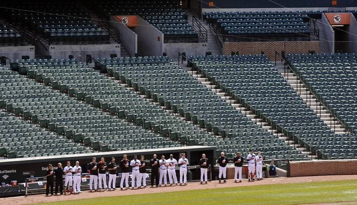 April 29, 2015 - Baltimore, MD, USA - Baltimore Orioles players, coaches and manager stand for the National Anthem on Wednesday, April 29, 2015, at Camden Yards in Baltimore. The game was closed to the public due to unrest in the city this week. MLB Baseball Herren USA 2015 - Baltimore Orioles Play In Empty Camden Yards - ZUMAm67_