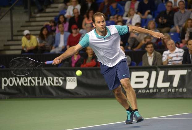 Winner of 14 Grand Slam titles Pete Sampras returns the ball against 17 Grand Slam titles winner John McEnroe during the PowerShares Champions showdown tennis tournament in Vancouver, Canada, May 2, 2015. It is the first ever PowerShares Series tennis circuit event held in Canada. ) (SP)CANADA-VANCOUVER-TENNIS SergeixBachlakov 