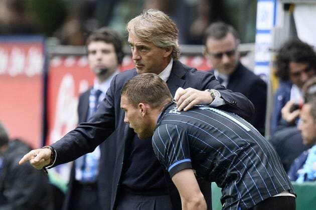 Mailand, Italien - Serie A, Inter Mailand vs. Chievo Verona: Roberto Mancini-Lucas Podolski 