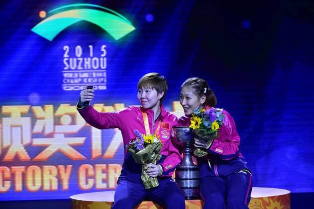 SUZHOU, CHINA - MAY 03: (CHINA OUT) Liu Shiwen and Zhu Yuling of China pose with their trophy after winning women s doubles final match against Ding Ning and Li Xiaoxia of China on day eight of the 2015 World Table tennis Tischtennis Championships at the Suzhou International Expo Center on May 3, 2015 in Suzhou, China.  CFP466952919 