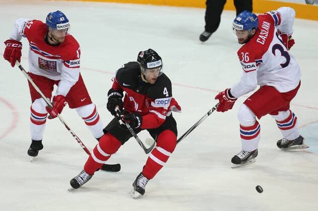 PRAGUE, CZECH REPUBLIC. MAY 4, 2015. Czech Republic s Michal Jordan (L), Petr Caslava (R) and Canada s Taylor Hall (C) fight for the puck in their 2015 IIHF World Championshiop Preliminary Round Group A Ice hockey Eishockey match at O2 Arena. The Canadian team won the game 6:3. Yelena Rusko TASS  TS001B1E