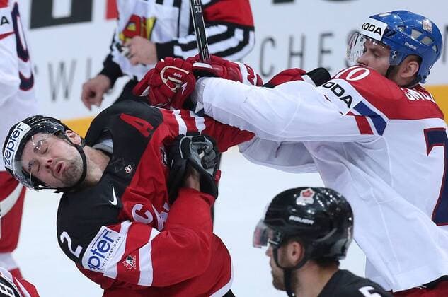 PRAGUE, CZECH REPUBLIC. MAY 4, 2015. Canada s Dan Hamhuis (L) and Czech Republic s Radek Smolenak fight in their 2015 IIHF World Championship WM Weltmeisterschaft Preliminary Round Group A Ice hockey Eishockey match at O2 Arena. The Canadian team won the game 6:3. Yelena Rusko TASS  TS001B2A