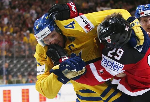 Ice hockey Eishockey - IIHF Ice Hockey WC 2015 PRAGUE,CZECH REPUBLIC,06.MAY.15 - ICE HOCKEY - IIHF World Ice Hockey Championships, international match Länderspiel Sweden vs Canada. Image shows Staffan Kronwall (SWE) and Nathan Mackinnon (CAN). Keywords: fight. GEPAxpictures xAndreasxPranter 