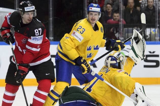 From left: Sidney Crosby (CAN), Oliver Ekman-Larsson (SWE) and goalkeeper Anders Nilsson (SWE) in action during the Ice hockey Eishockey World Championship WM Weltmeisterschaft Group A match Sweden vs Canada in Prague, Czech Republic, May 6, 2015. (CTKxPhoto MichalxKamaryt) CTKPhotoP201505061059101  kmt 14