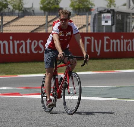 May 7, 2015 - Barcelona, Spain - SEBASTIAN VETTEL of Germany and Scuderia Ferrari is seen riding a bicycle on the track during preparations to the 2015 Formula 1 Spanish Grand Prix at Circuit de Catalunya in Barcelona, Spain. F1 2015 - Spanish Grand Prix - Preparations - ZUMAg147