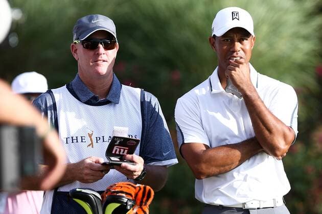 May 7, 2015 - Ponte Vedra Beach, Florida, United States - Tiger Woods (R) and his caddie Joe LaCava wait on the 18th tee during the first round of THE PLAYERS Championship. THE PLAYERS Championship - Round 1 - ZUMAw109
