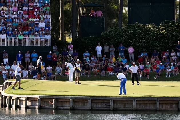 May 7, 2015 - Ponte Vedra Beach, Florida, United States - Phil Mickelson (C) putts the 17th green during the first round of THE PLAYERS Championship. THE PLAYERS Championship - Round 1 - ZUMAw109