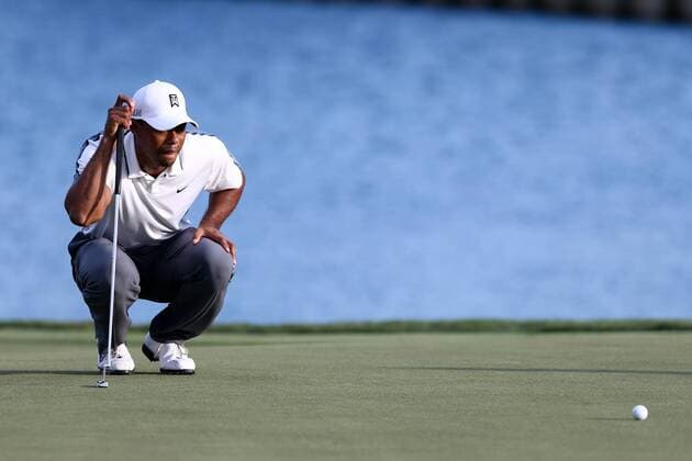 May 7, 2015 - Ponte Vedra Beach, Florida, United States - Tiger Woods lines up a putt on the 18th green during the first round of THE PLAYERS Championship. THE PLAYERS Championship - Round 1 - ZUMAw109