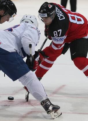 Ice hockey Eishockey - IIHF Ice Hockey WC 2015 PRAGUE,CZECH REPUBLIC,09.MAY.15 - ICE HOCKEY - IIHF World Ice Hockey Championships, international match Länderspiel France vs Canada. Image shows Damien Raux (FRA) and Sidney Crosby (CAN). GEPAxpictures xAndreasxPranter 