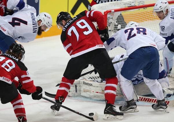 Ice hockey Eishockey - IIHF Ice Hockey WC 2015 PRAGUE,CZECH REPUBLIC,09.MAY.15 - ICE HOCKEY - IIHF World Ice Hockey Championships, international match Länderspiel France vs Canada. Image shows Antonin Manavian (FRA), Ryan O Reilly (CAN), Damien Raux and Yohann Auvitu (FRA). GEPAxpictures xAndreasxPranter 