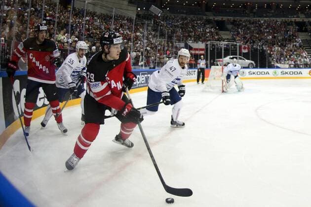From left: Jonathan Janil (FRA), Nathan MacKinnon (CANd and Teddy Trabichet (FRA) in action during the Ice hockey Eishockey World Championship WM Weltmeisterschaft Group A match France vs Canada in Prague, Czech Republic, May 9, 2015. (CTKxPhoto MichalxKamaryt) CTKPhotoP201505090321701  kmt 19