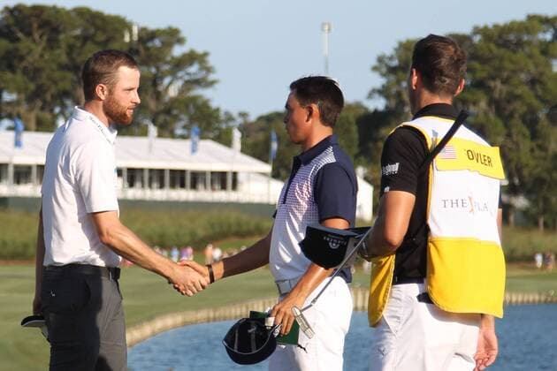 May 9, 2015 - Ponte Vedra Beach, Florida, United States - Chris Kirk (L) shakes hands with Rickie Fowler on the 18th green after the third round of THE PLAYERS Championship. THE PLAYERS Championship - Round 3 - ZUMAw109