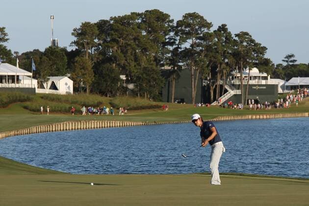 May 9, 2015 - Ponte Vedra Beach, Florida, United States - Kevin Na chips on to the 18th green during the third round of THE PLAYERS Championship. THE PLAYERS Championship - Round 3 - ZUMAw109