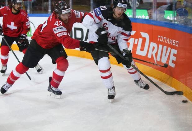 Ice hockey Eishockey - IIHF Ice Hockey WC 2015 PRAGUE,CZECH REPUBLIC,10.MAY.15 - ICE HOCKEY - IIHF World Ice Hockey Championships, international match Länderspiel Switzerland vs Canada. Image shows Morris Trachsler (SUI) and Cody Eakin (CAN). GEPAxpictures xAndreasxPranter 