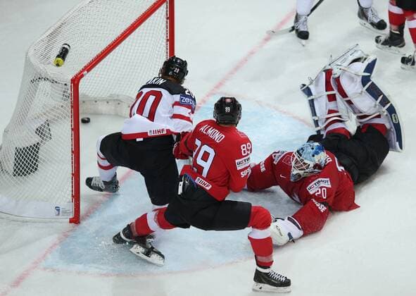 Ice hockey Eishockey - IIHF Ice Hockey WC 2015 PRAGUE,CZECH REPUBLIC,10.MAY.15 - ICE HOCKEY - IIHF World Ice Hockey Championships, international match Länderspiel Switzerland vs Canada. Image shows Reto Berra (SUI), Cody Eakin (CAN) and Cody Almond (SUI). GEPAxpictures xAndreasxPranter 