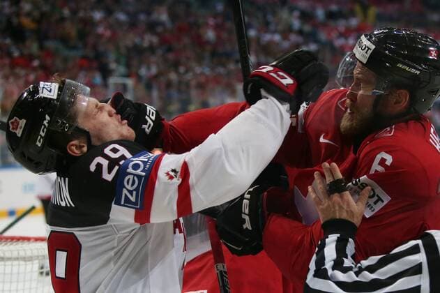 Ice hockey Eishockey - IIHF Ice Hockey WC 2015 PRAGUE,CZECH REPUBLIC,10.MAY.15 - ICE HOCKEY - IIHF World Ice Hockey Championships, international match Länderspiel Switzerland vs Canada. Image shows Nathan Mackinnon (CAN) and Timo Helbling (SUI). Keywords: fight. GEPAxpictures xAndreasxPranter 