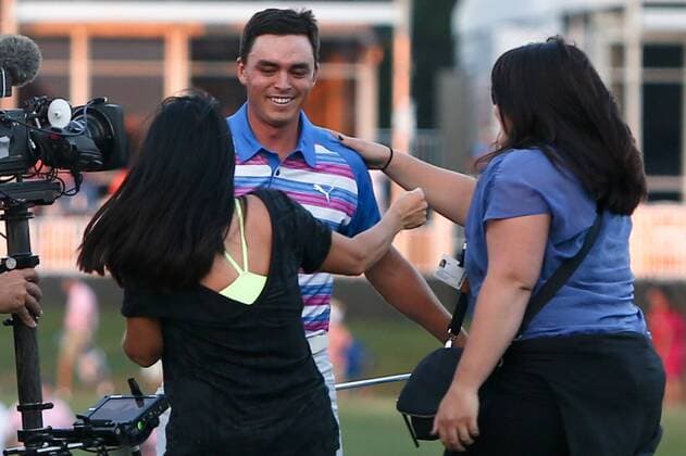 May 10, 2015 - Ponte Vedra Beach, Florida, United States - Rickie Fowler (C) is hugged by his mother, Lynn Fowler (L) and sister Taylor Fowler on the 17th green after winning the sudden death playoff round of THE PLAYERS Championship. THE PLAYERS Championship - Final Round - ZUMAw109