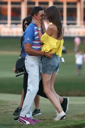 May 10, 2015 - Ponte Vedra Beach, Florida, United States - Rickie Fowler kisses his girlfriend Alexis Randock (R) on the 17th green after winning the sudden death playoff round of THE PLAYERS Championship. THE PLAYERS Championship - Final Round - ZUMAw109