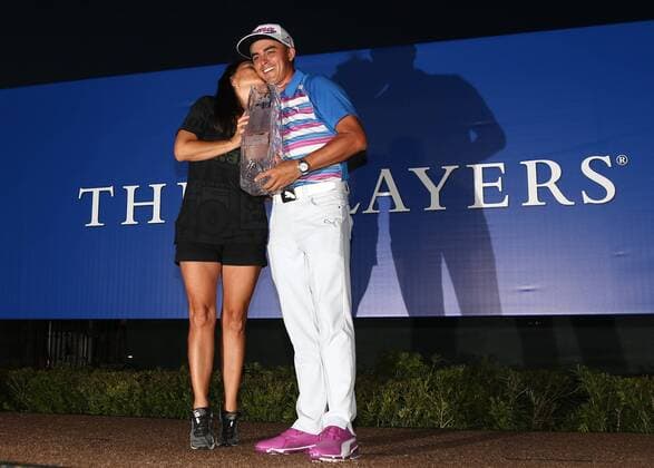 May 10, 2015 - Ponte Vedra Beach, Florida, United States - Lynn Fowler (L) and Rickie Fowler hold the trophy after the final round of THE PLAYERS Championship. THE PLAYERS Championship - Final Round - ZUMAw109