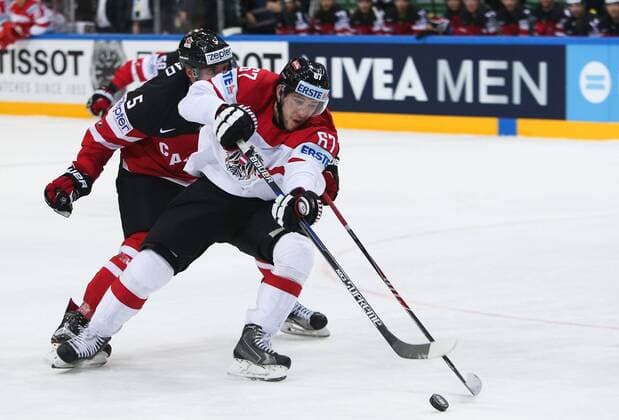 Ice hockey Eishockey - IIHF Ice Hockey WC 2015 PRAGUE,CZECH REPUBLIC,12.MAY.15 - ICE HOCKEY - IIHF World Ice Hockey Championships, international match Länderspiel Canada vs Austria. Image shows Aaron Ekblad (CAN) and Konstantin Komarek (AUT). GEPAxpictures xAndreasxPranter 