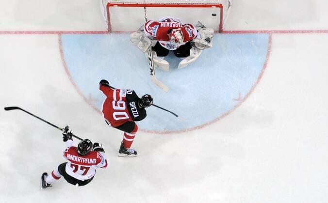 From bottom: defender Thomas Hundertpfund (AUT) and Jason Spezza (CAN) scores against goalkeeper Bernhard Starkbaum (AUT) during their Hockey World Championships Group A match Canada vs Austria in Prague, Czech Republic, May 12, 2015. (CTKxPhoto MichalxKamaryt) CTKPhotoP201505120650101  kmt 11