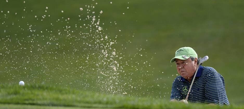 May 13, 2015 - Charlotte, NC, USA - Golf - - Felix Sabates watches his ball catch the lip of a sand bunker at the first green during the Pro-Am on Wednesday, May 13, 2015, at Quail Hollow Club in Charlotte, N.C. Wells Fargo Pro-Am round - ZUMAm67_