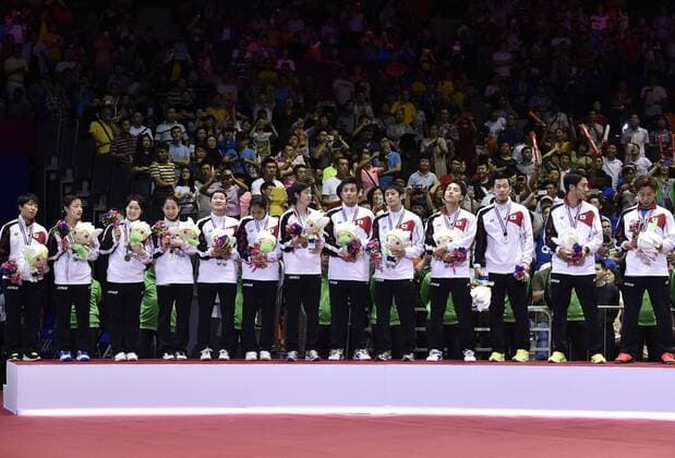 (150517) -- DONGGUAN, May 17, 2015 -- Silver medallists, Players of Japan celebrate during the awarding ceremony after the final of 2015 Sudirman Cup BWF World Mixed Team Championships in Dongguan, south China s Guangdong Province, May 17, 2015. ) (SP)CHINA-DONGGUAN-BADMINTON-2015 SUDIRMAN CUP(CN) LiangxXu 