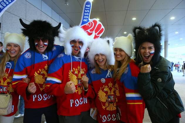 PRAGUE, CZECH REPUBLIC. MAY 17, 2015. Supporters of the Russian national team Nationalteam with painted faces, in fur hats pump their fists as they pose for a photograph ahead of the 2015 International Ice hockey Eishockey Federation World Championchip final game between Russia and Canada. Valery Sharifulin TASS  TS003802