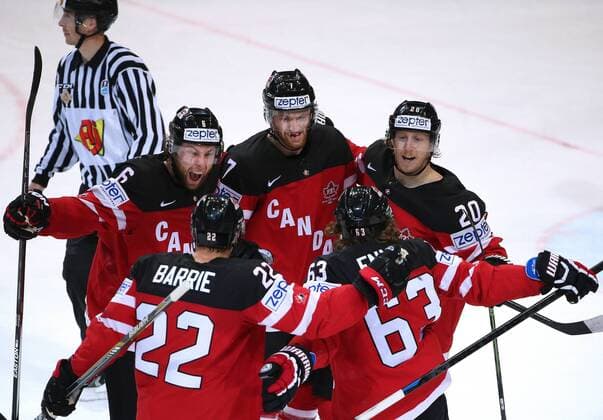 PRAGUE, CZECH REPUBLIC. MAY 17, 2015. Canada s Tyson Barrie, Tyler Ennis (L-R front) and Jake Muzzin, Sean Couturier, Cody Eakin (L-R background) celebrate scoring in their 2015 IIHF Ice hockey Eishockey World Championship WM Weltmeisterschaft final match against Russia at O2 Arena. Valery Sharifulin TASS  TS00380E