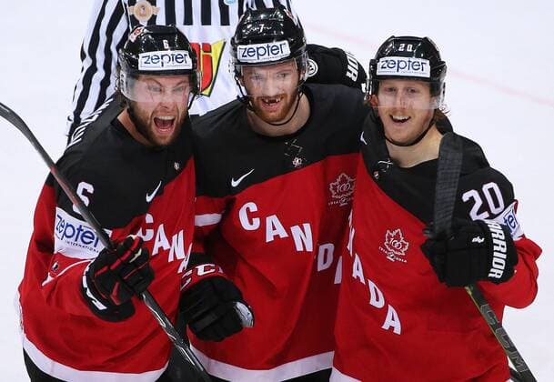PRAGUE, CZECH REPUBLIC. MAY 17, 2015. Canada s Jake Muzzin, Sean Couturier, and Cody Eakin (L-R) celebrate scoring in their 2015 IIHF Ice hockey Eishockey World Championship WM Weltmeisterschaft final match against Russia at O2 Arena. Valery Sharifulin TASS  TS003810