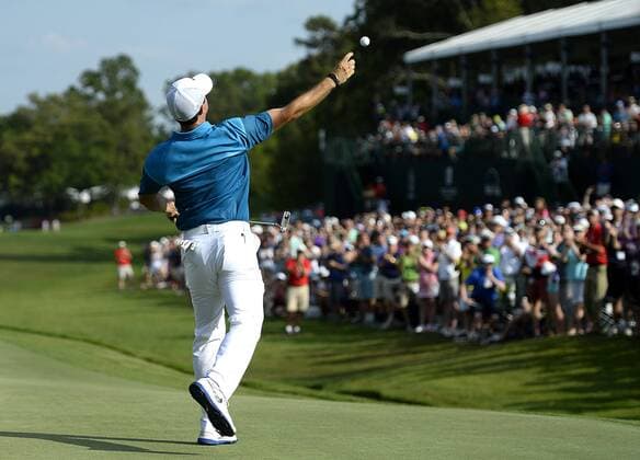 May 17, 2015 - Charlotte, NC, USA - Rory McIlroy turns and throws his golf ball into the gallery after sinking his final putt on the 18th green during the final round of the Wells Fargo Championship on Sunday, May 17, 2015, at Quail Hollow Club in Charlotte, N.C. Wells Fargo Championship, final round - ZUMAm67_