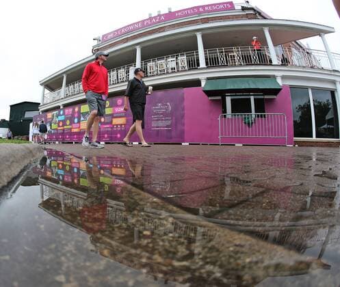 May 21, 2015 - Fort Worth, TX, USA - Golf fans begin to drift in to a very wet Colonial grounds after heavy morning rains the morning of the first day of competition at the Crowne Plaza Invitational at Colonial on May 21, 2015 in Fort Worth, Texas. Crowne Plaza Invitational golf - ZUMAm67_