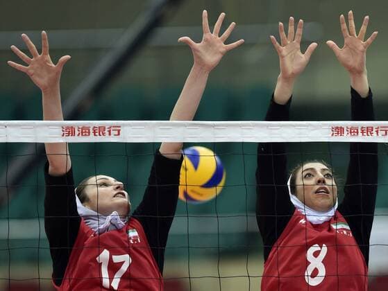 (150523) -- TIANJIN, May 23, 2015 -- Safari (L) and Saberi of Iran compete during the match against Vietnam at the 18th Asian Senior Women s Volleyball Championships in Tianjin, north China, on May 23, 2015. Iran lost 2-3. ) (SP)CHINA-TIANJIN-VOLLEYBALL-ASIAN SENIOR WOMEN S CHAMPIONSHIPS (CN) YuexYuewei 