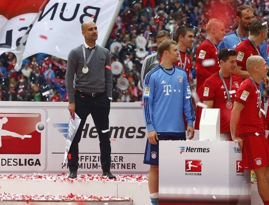 SOCCER - 1. DFL, Bayern vs Mainz MUNICH,GERMANY,23.MAY.15 - SOCCER - 1. DFL, 1. Deutsche Bundesliga, FC Bayern Muenchen vs 1. FSV Mainz 05. Image shows head coach Pep Guardiola (Bayern). Keywords: medal. GEPA xFelixxRoittner