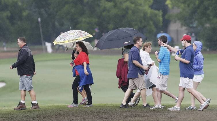 May 23, 2015 - Fort Worth, TX, USA - Fans slog their way through a muddy fairway during the third round of the Crowne Plaza Invitational at the Colonial in Fort Worth, Texas, on Saturday, May 23, 2015. Crowne Plaza Invitational at the Colonial, third round - ZUMAm67_