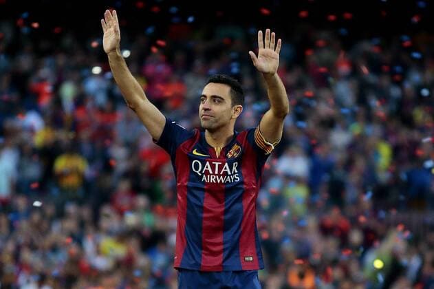 (150524) -- BARCELONA, Barcelona s captain Xavi Hernandez waves to the spectators during his tribute after the Spanish BBVA La Liga (first division soccer league) match bwtween FC Barcelona Barca and RC Deportivo La Coruna at Camp Nou stadium in Barcelona, Spain, May 23, 2015. Xavi announced on Thursday his retirement from Barcelona at the end of the current season. He will play next season at Al Sadd in Qatar.)(wll) (SP)SPAIN-BARCELONA-SOCCER-LA LIGA PauxBarrena 